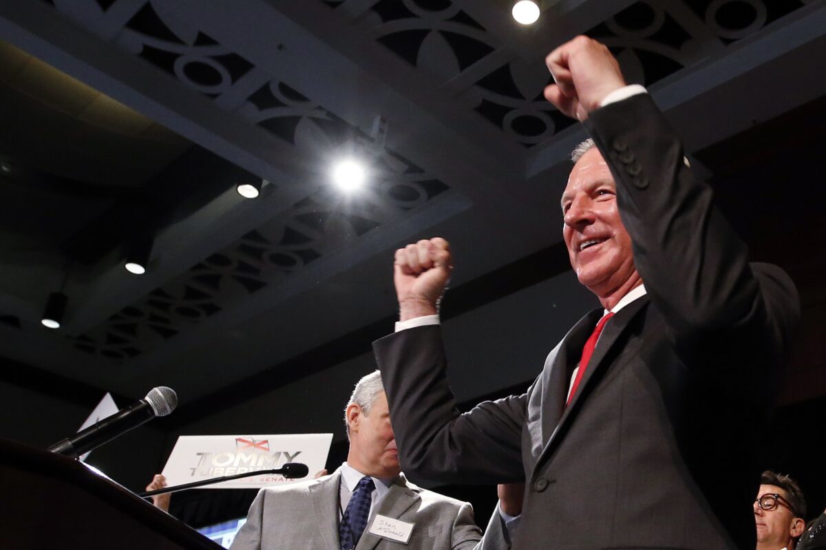 Republican Tommy Tuberville celebrates as he walks to the stage to speak to supporters after his win in the race for U.S. Senate, at his watch party Tuesday, Nov. 3, 2020, in Montgomery, Ala. (AP Photo/Butch Dill)