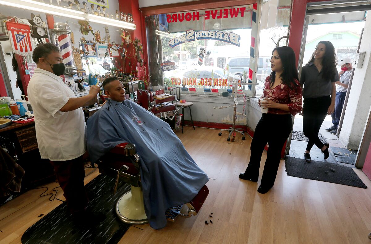 People in a barber shop.