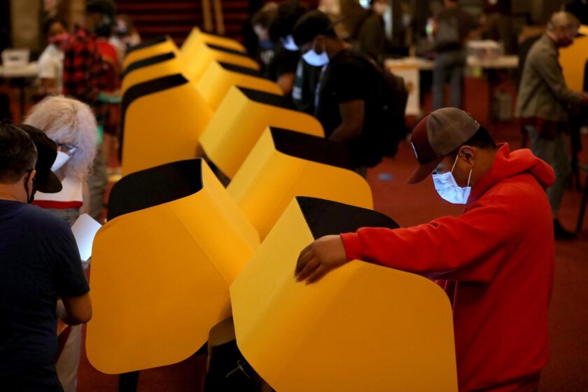 Voters cast their ballots on Election Day at the Pantages Theatre in Hollywood in Los Angeles on November 3, 2020. 