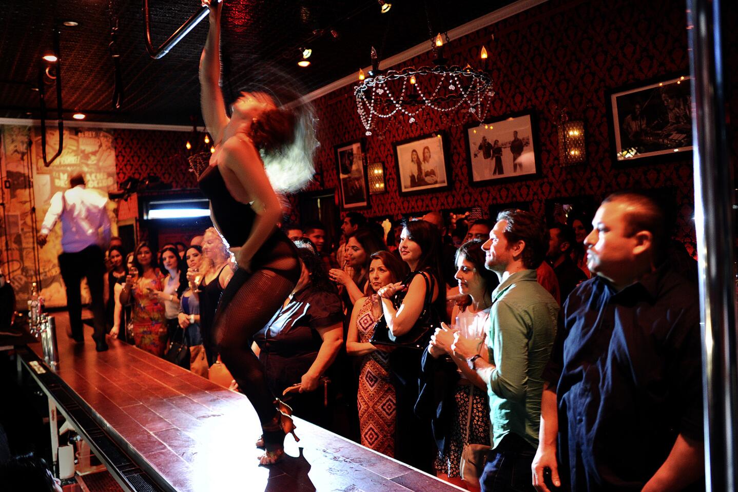 Customers enjoy a burlesque show on a Saturday night at the Eastside Luv wine bar in Boyle Heights. When it opened next door to Las Palomas in 2006, the neighborhood was hearing increasing chatter about imminent gentrification.