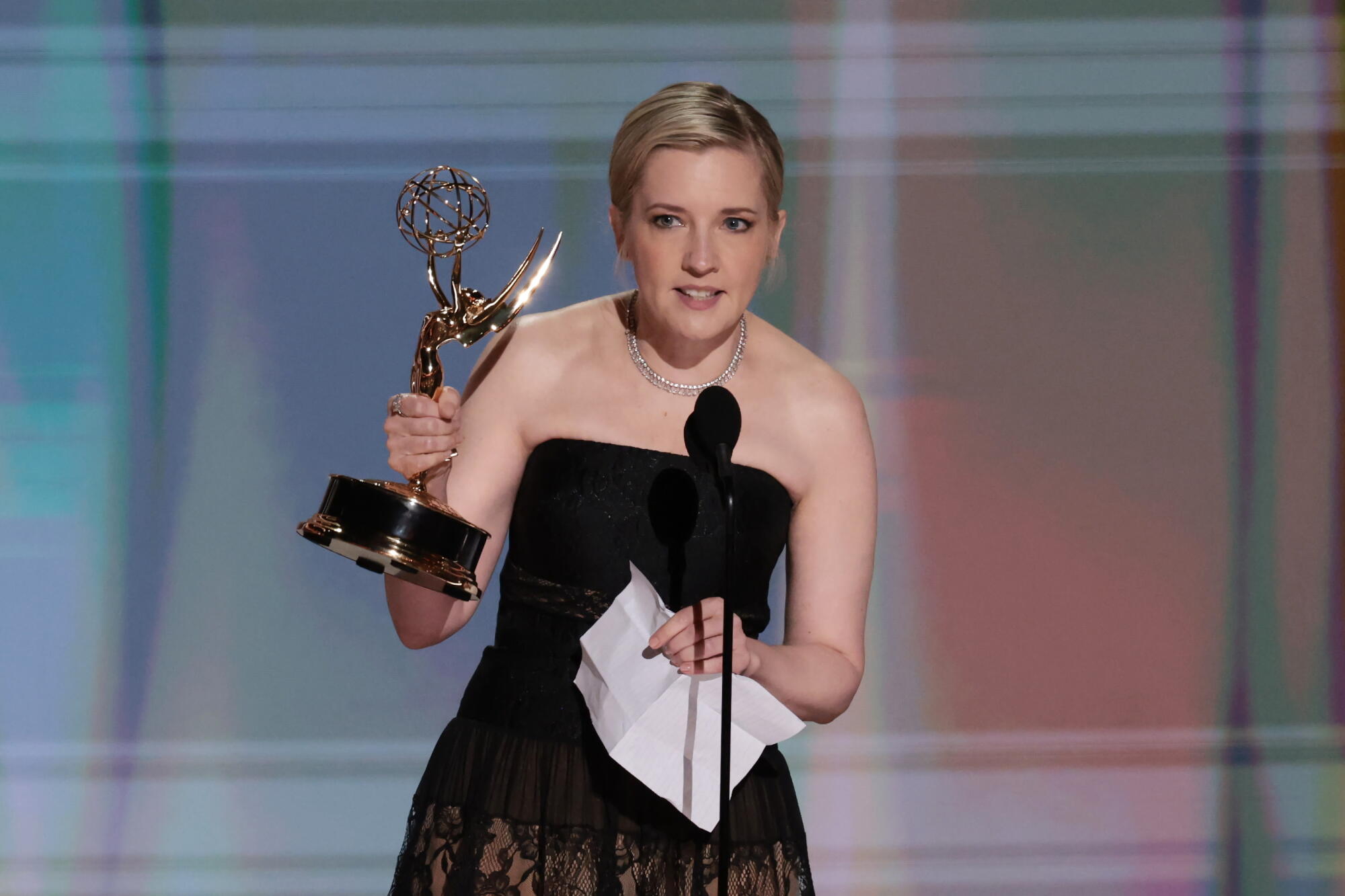 Katie Dippold accepts the Emmy for writing in a comedy series for "Widow's Bay" during the 2026 Emmy Awards.