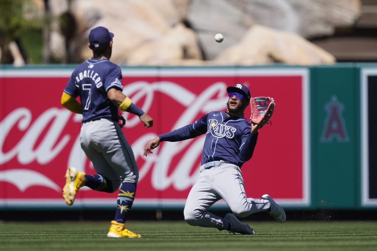 Rays center fielder Jose Siri makes a sliding catch during the second inning.