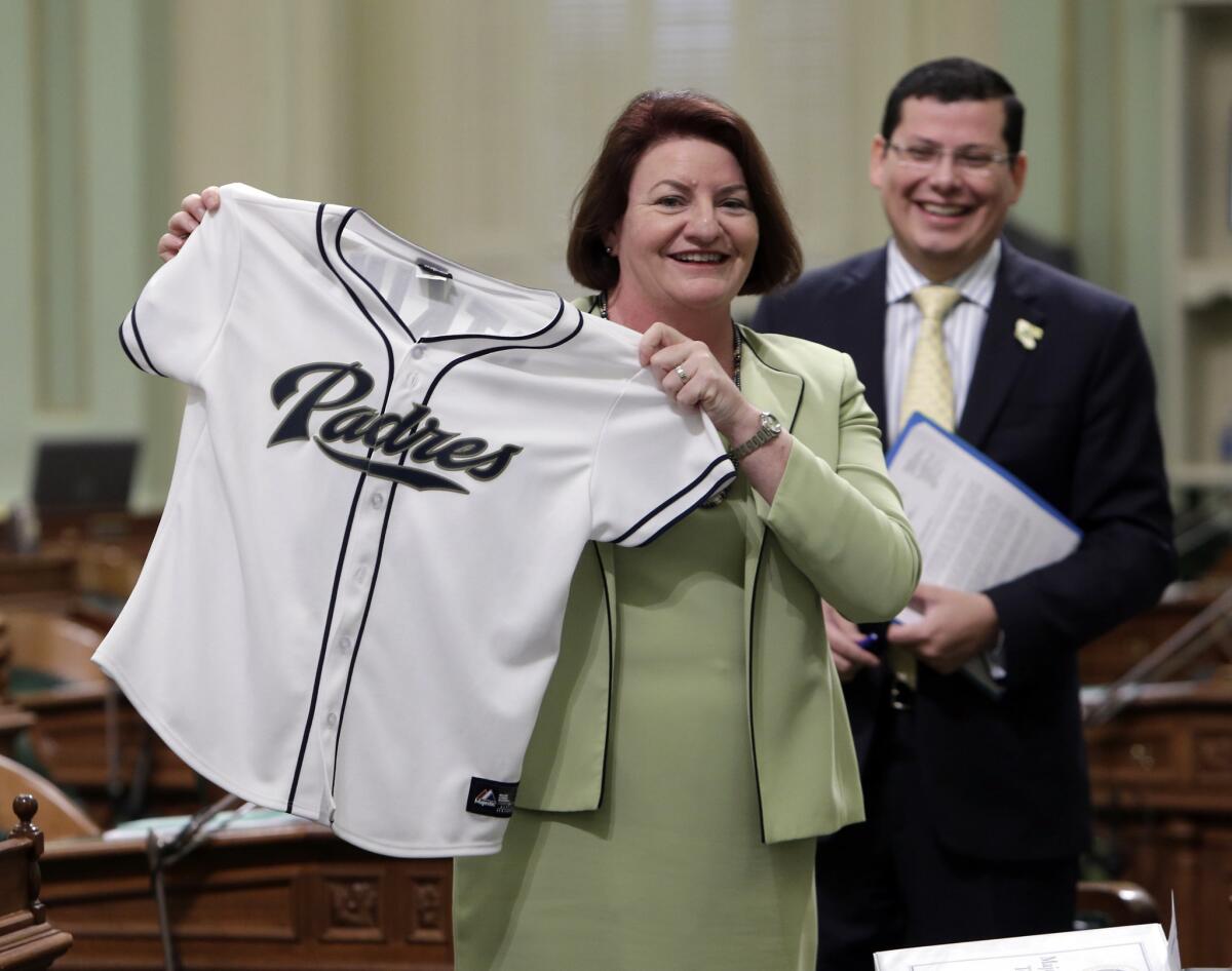 Assemblywoman Toni Atkins (D-San Diego) displays a San Diego Padres jersey given to her by a fellow assemblyman last month. Atkins will be sworn in as speaker on May 12.
