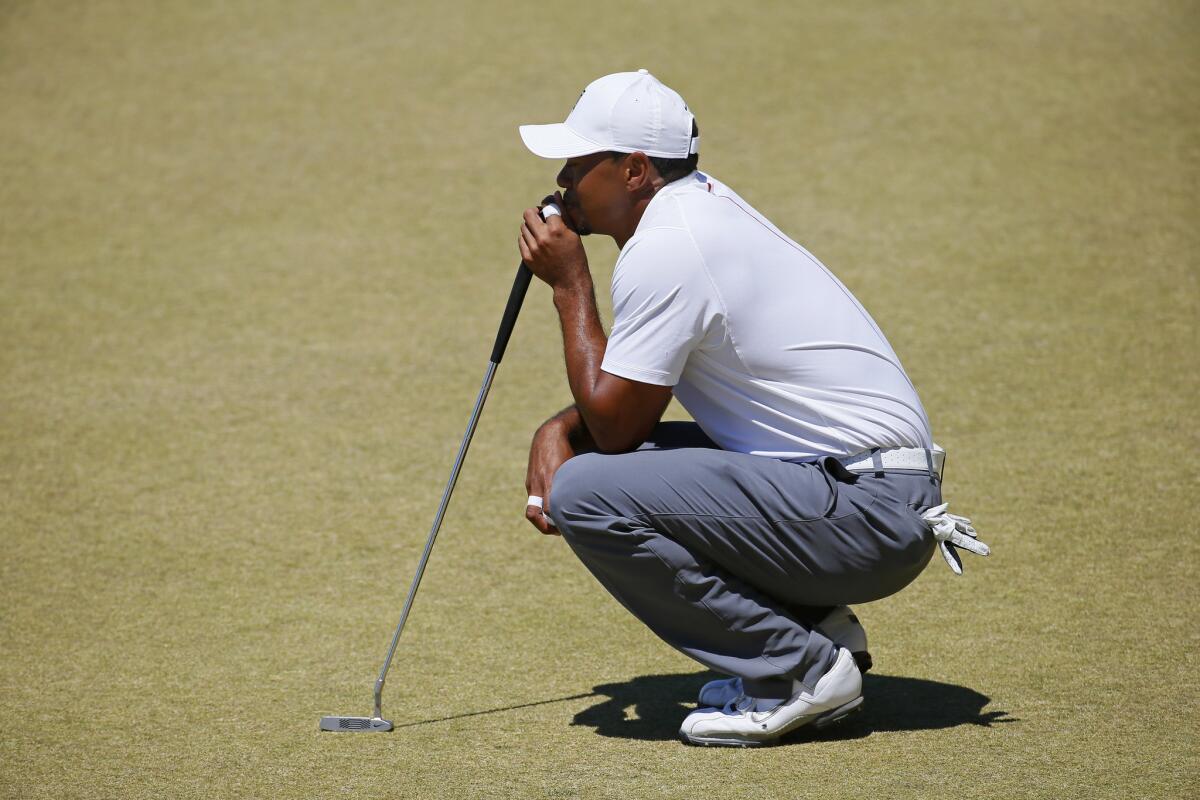 Tiger Woods lines up his putt on the eighth hole during the second round of the U.S. Open on Friday at Chambers Bay in University Place, Wash.