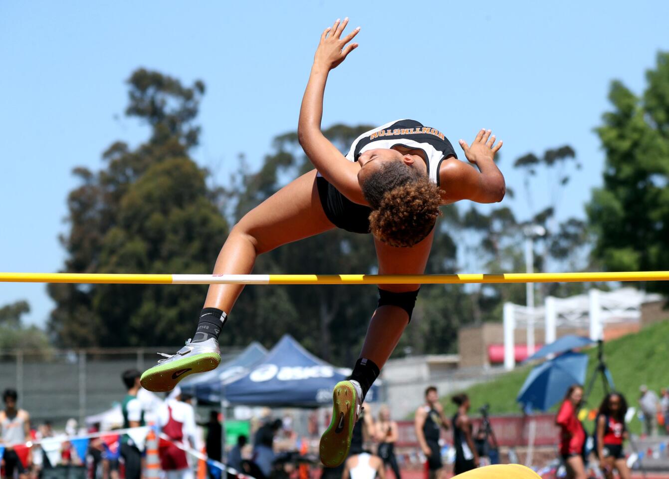 Huntington Beach High School high jumper Xolani Hodel clears the bar early in competition at the Orange County Track and Field Championships, at Mission Viejo High School, in Mission Viejo on Saturday, April 13, 2019.