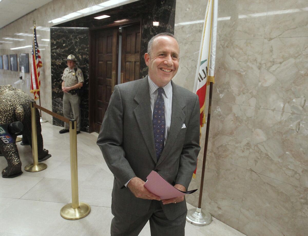 Senate President Pro Tem Darrell Steinberg (D-Sacramento) smiles as he leaves a budget meeting with Gov. Jerry Brown in Sacramento in June.