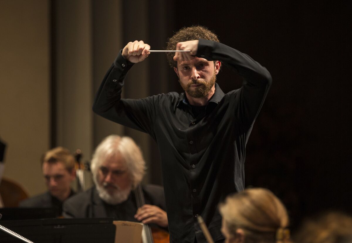 Matthew Aucoin conducts the world premiere of his score, "Evidence," with the Los Angeles Chamber Orchestra on Saturday night at the Alex Theatre.
