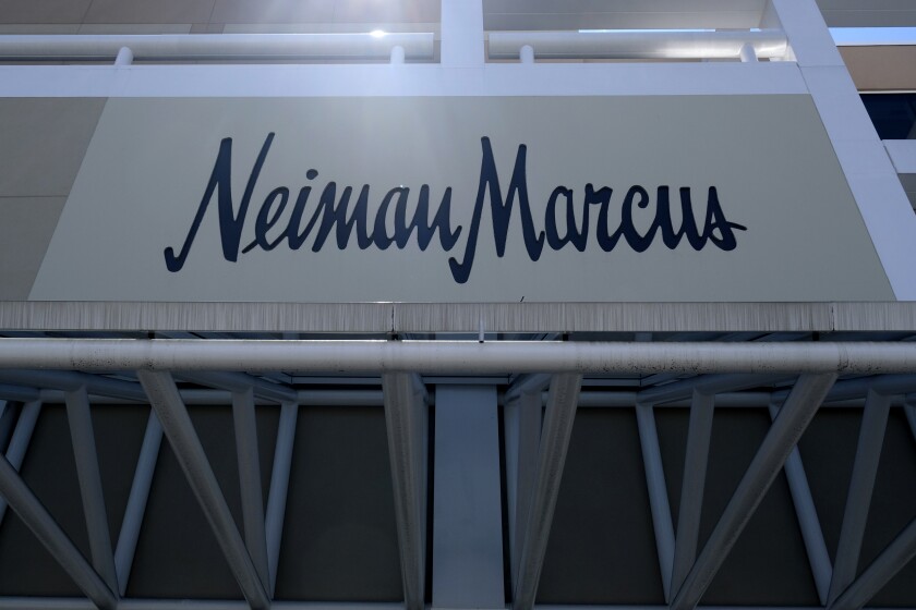 FILE - This May 7, 2020 file photo shows a closed Neiman Marcus store at the Garden State Plaza mall in Paramus, N.J. Neiman Marcus is hoping to capitalize on rebounding luxury sales by investing more than $500 million over the next three years in refreshing stores, speeding up deliveries and acquiring new technology. The plan, unveiled Tuesday, June 15, 2021, includes a pact to purchase Stylyze Inc., a startup that recommends outfits for customers based on past purchases and browsing history. (AP Photo/Seth Wenig)