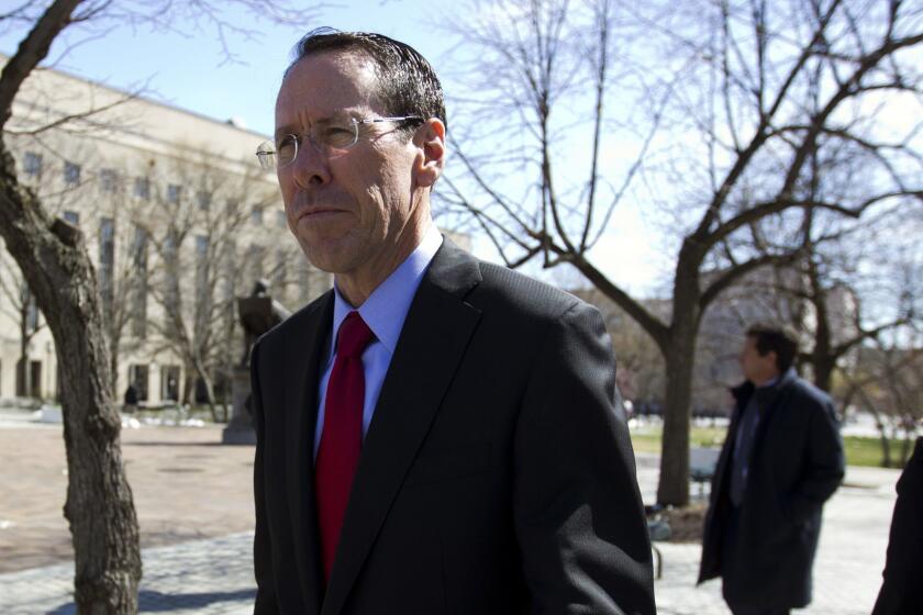 AT&T CEO Randall Stephenson leaves the federal courthouse Thursday, March 22, 2018, in Washington. The Trump administration is facing off against AT&T to block the telephone giant from absorbing Time Warner, in a case that could shape how consumers get, and how much they pay for, streaming TV and movies. (AP Photo/Jose Luis Magana)