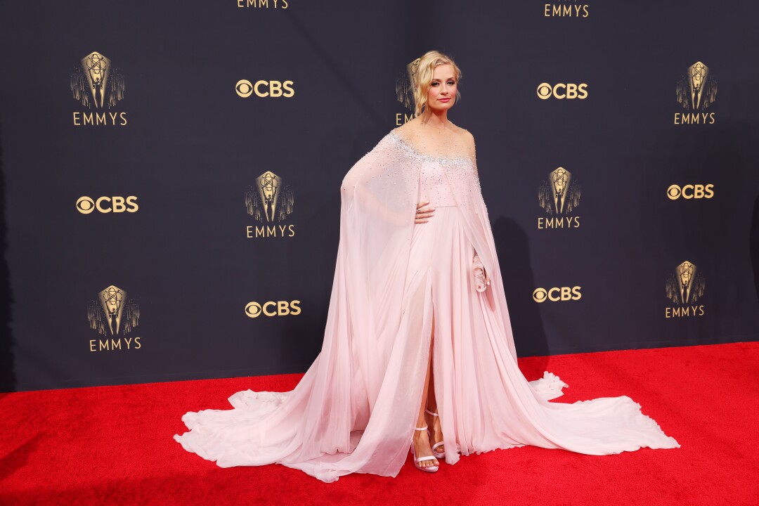 A woman in a light-pink gown on the red carpet.