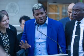 LOS ANGELES, CA - February 11, 2023: Former Dodgers outfielder Yasiel Puig, center, speaks at a news conference outside the federal courthouse in downtown Los Angeles on Saturday February 11, 2023 in Los Angeles, CA. (Brian van der Brug / Los Angeles Times)