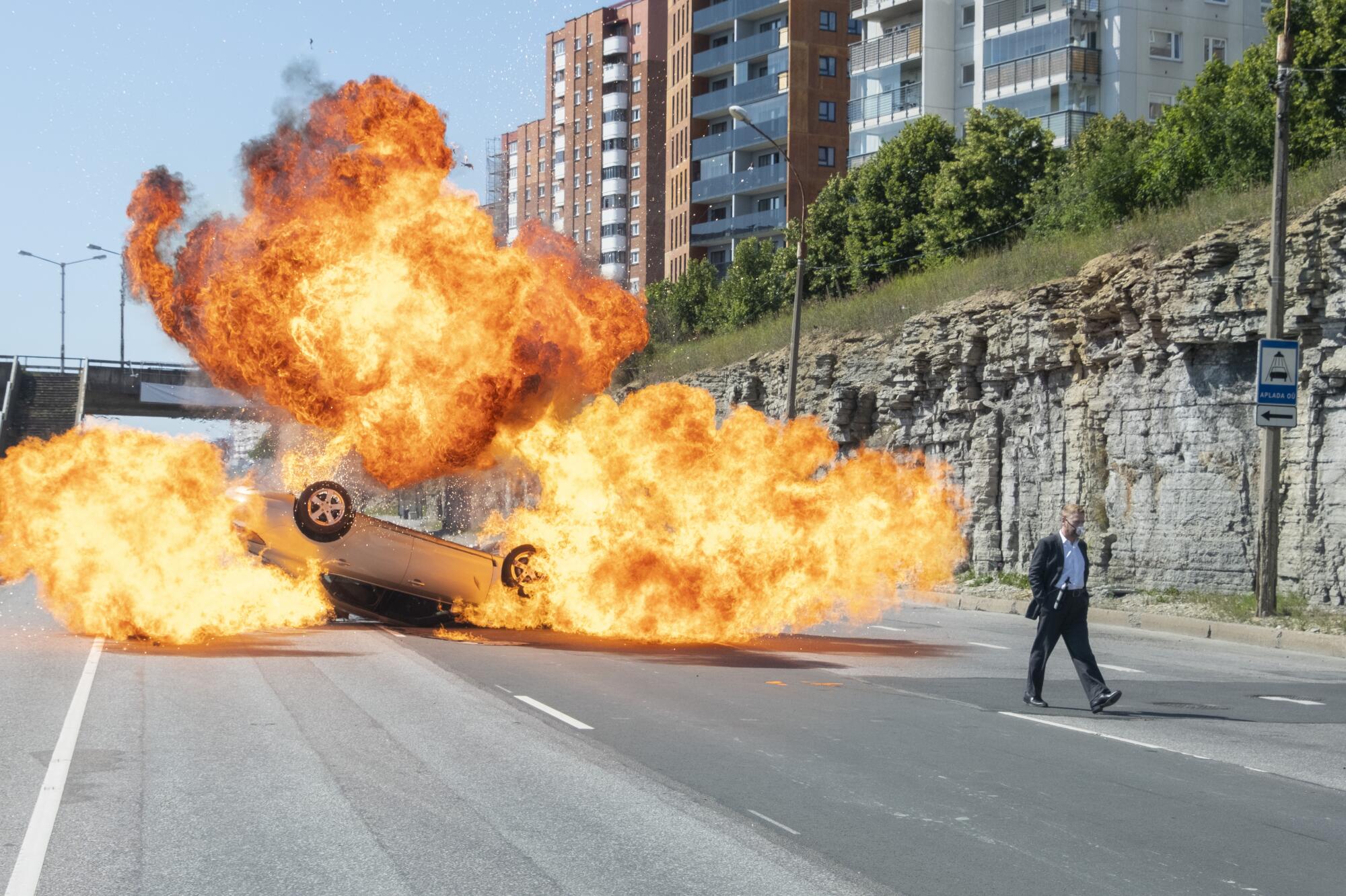 Kenneth Branagh calmly walks away from an exploding car in "Tenet."