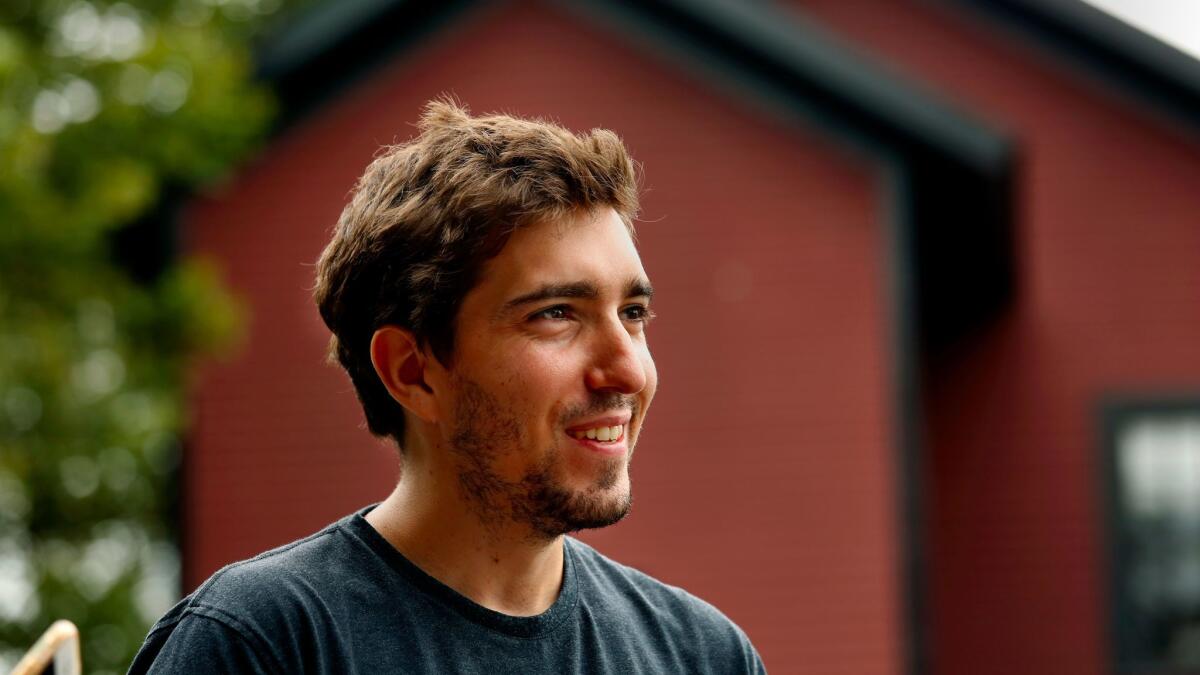 Bauman poses near his home in Concord, Mass.