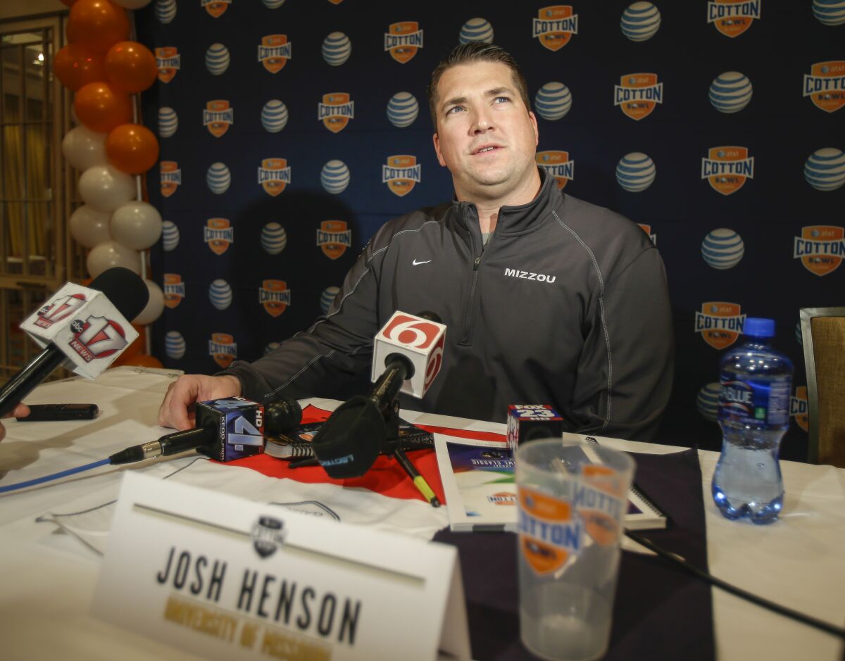 Josh Henson speaks to reporters at a news conference in December 2013 during his time as Missouri offensive coordinator.