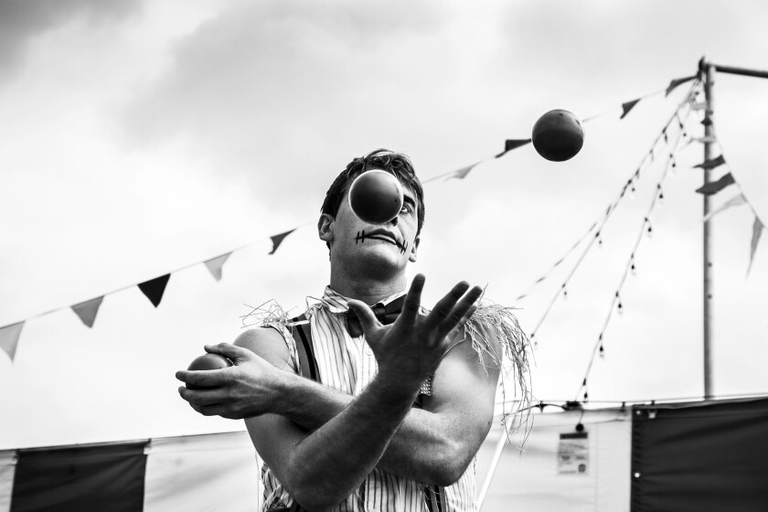 Portrait of a juggler practicing behind the tent at Venardos Circus exhibited in "Troupes + Tribes."