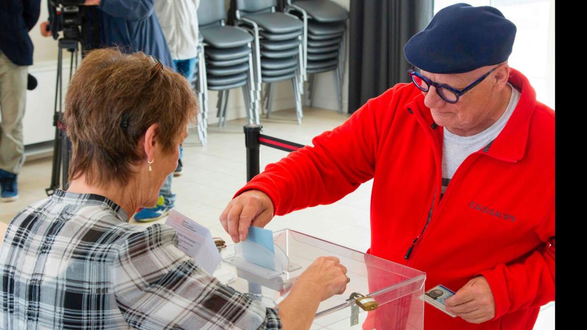 A man casts his vote in Saint-Pierre in the French overseas Collectivity of Saint-Pierre and Miquelon on June 17, 2017, for the National Assembly election.