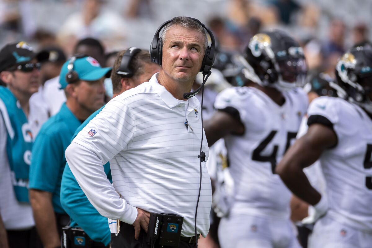 Jacksonville Jaguars head coach Urban Meyer watches a play on the stadium's video monitor 
