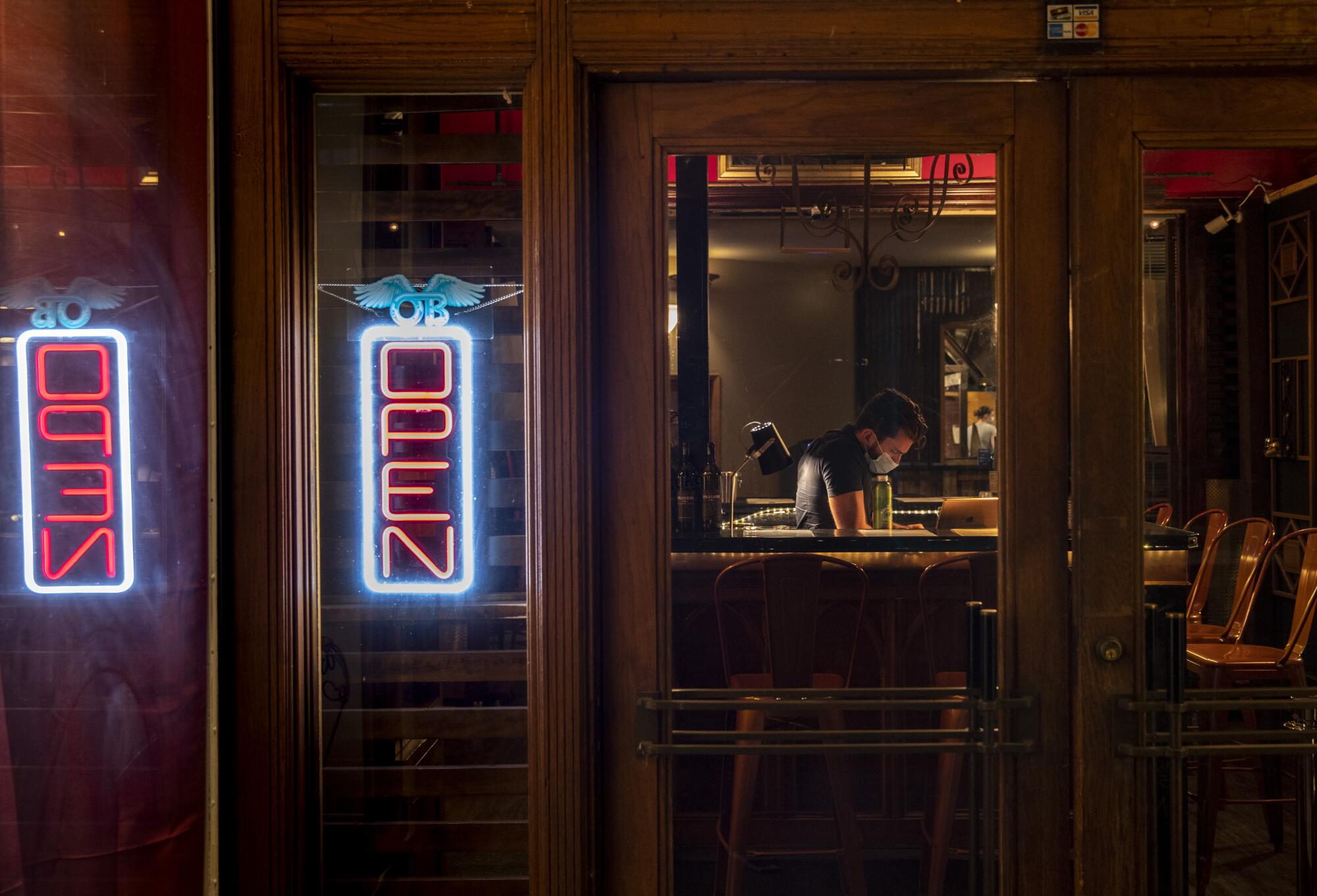 Tasting room associate Dakota Croog waits for customers at Passion Cellars, a wine tasting bar in Bisbee.