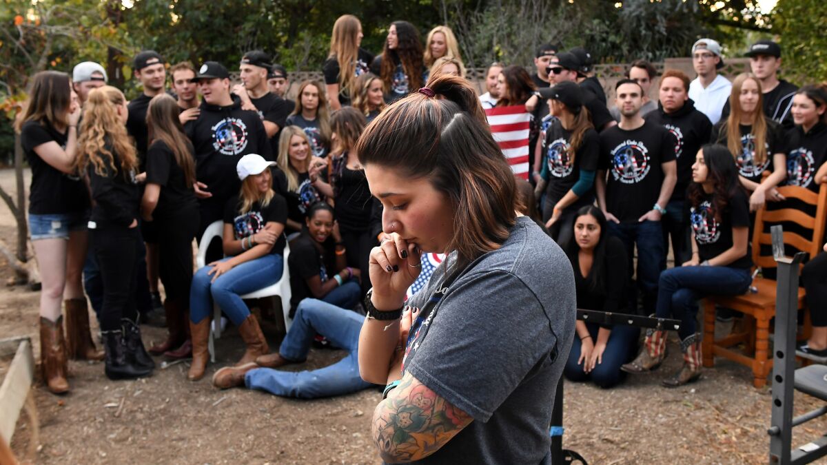 Katie Wilkie pauses before a group photo of the survivors of the Borderline Bar & Grill in the Thousand Oaks Tuesday.