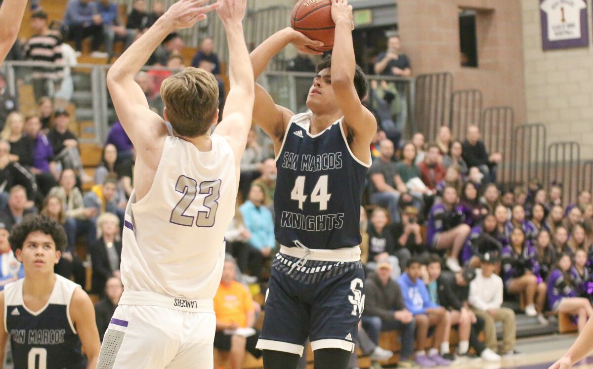 Devon Arlington (#44) takes a jumper in the lane.