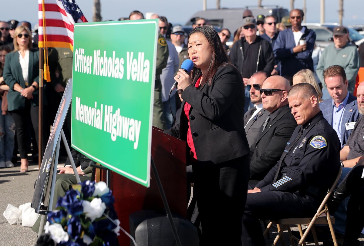 State Sen. Janet Nguyen speaks during Saturday's ceremony for a memorial highway sign honoring Officer Nicholas Vella.