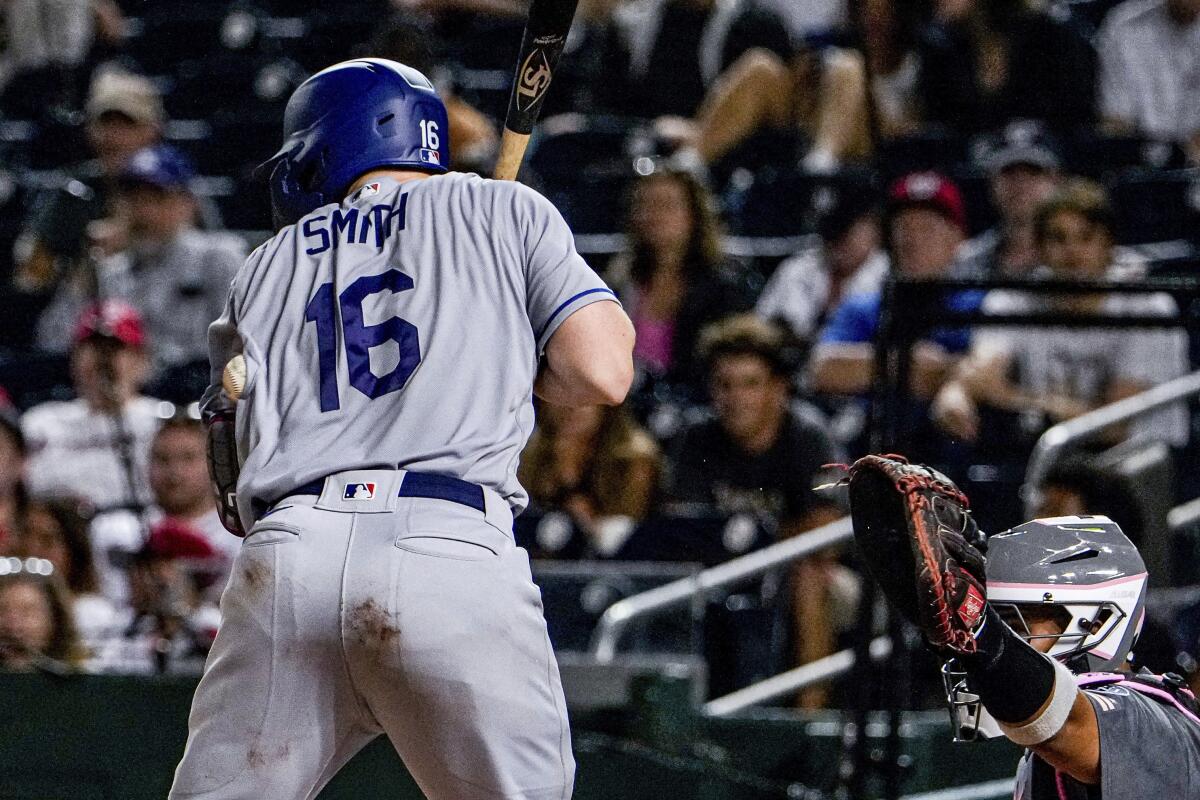 The Dodgers' Will Smith is hit by a pitch during the eighth inning.