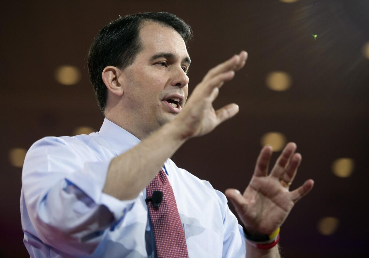 Wisconsin Gov. Scott Walker gestures while speaking during the Conservative Political Action Conference in National Harbor, Md.