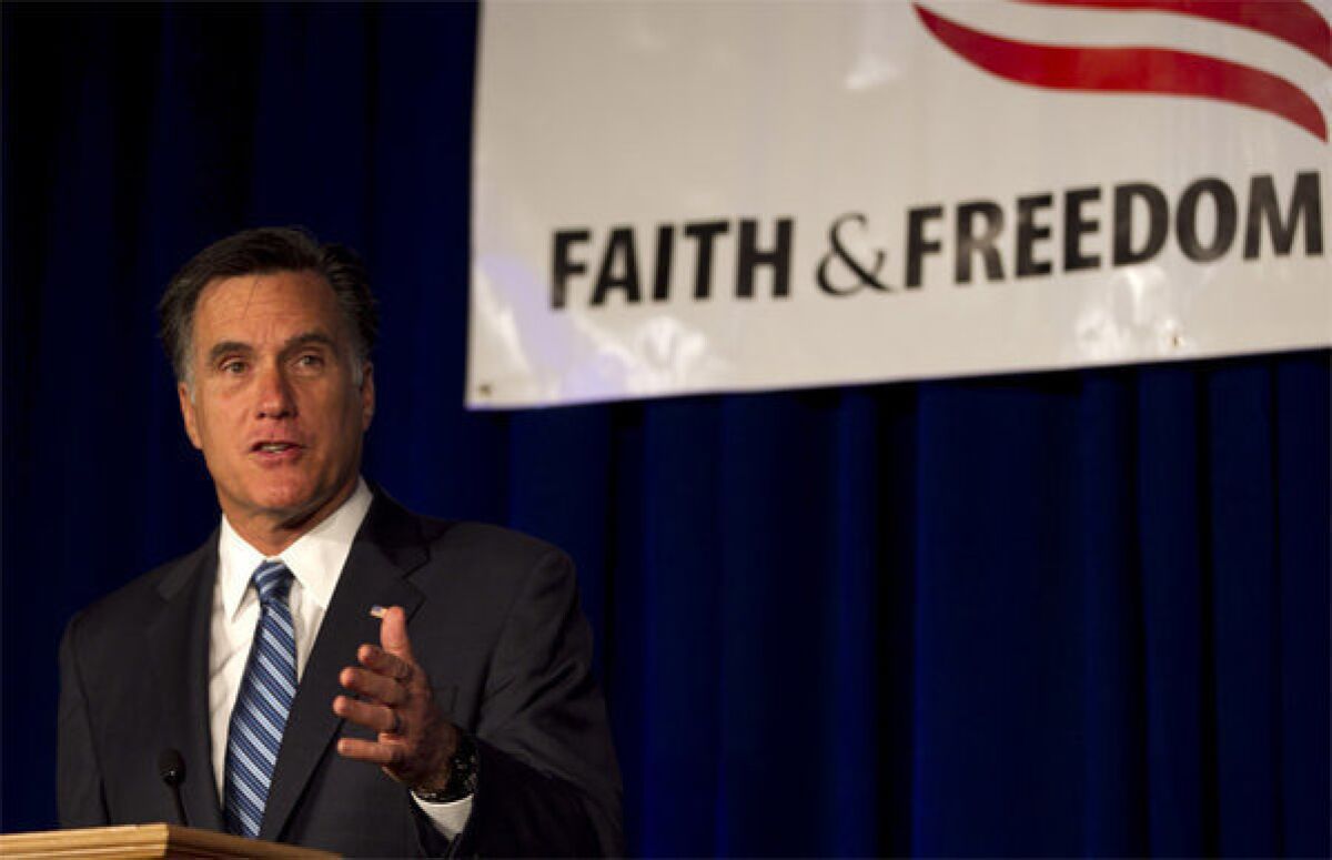Republican presidential candidate Mitt Romney speaks to an audience at a meeting of the Wisconsin Faith & Freedom Coalition