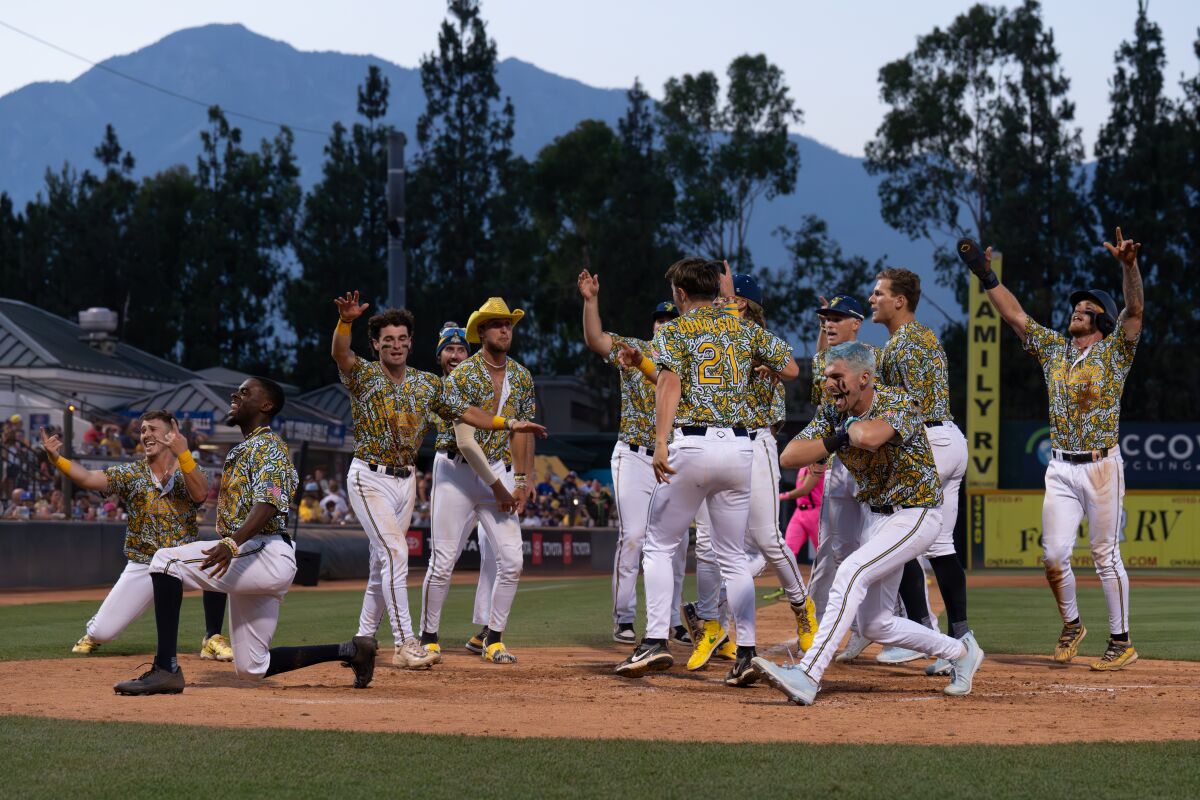 Savannah Bananas players dance on the mound during a game in Rancho Cucamonga Friday.