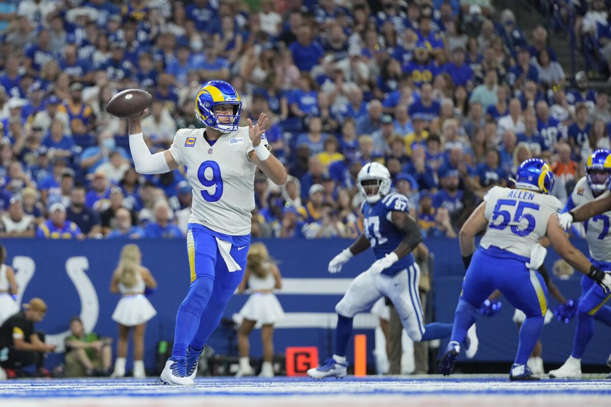 Rams quarterback Matthew Stafford unleashes a throw against the Colts.