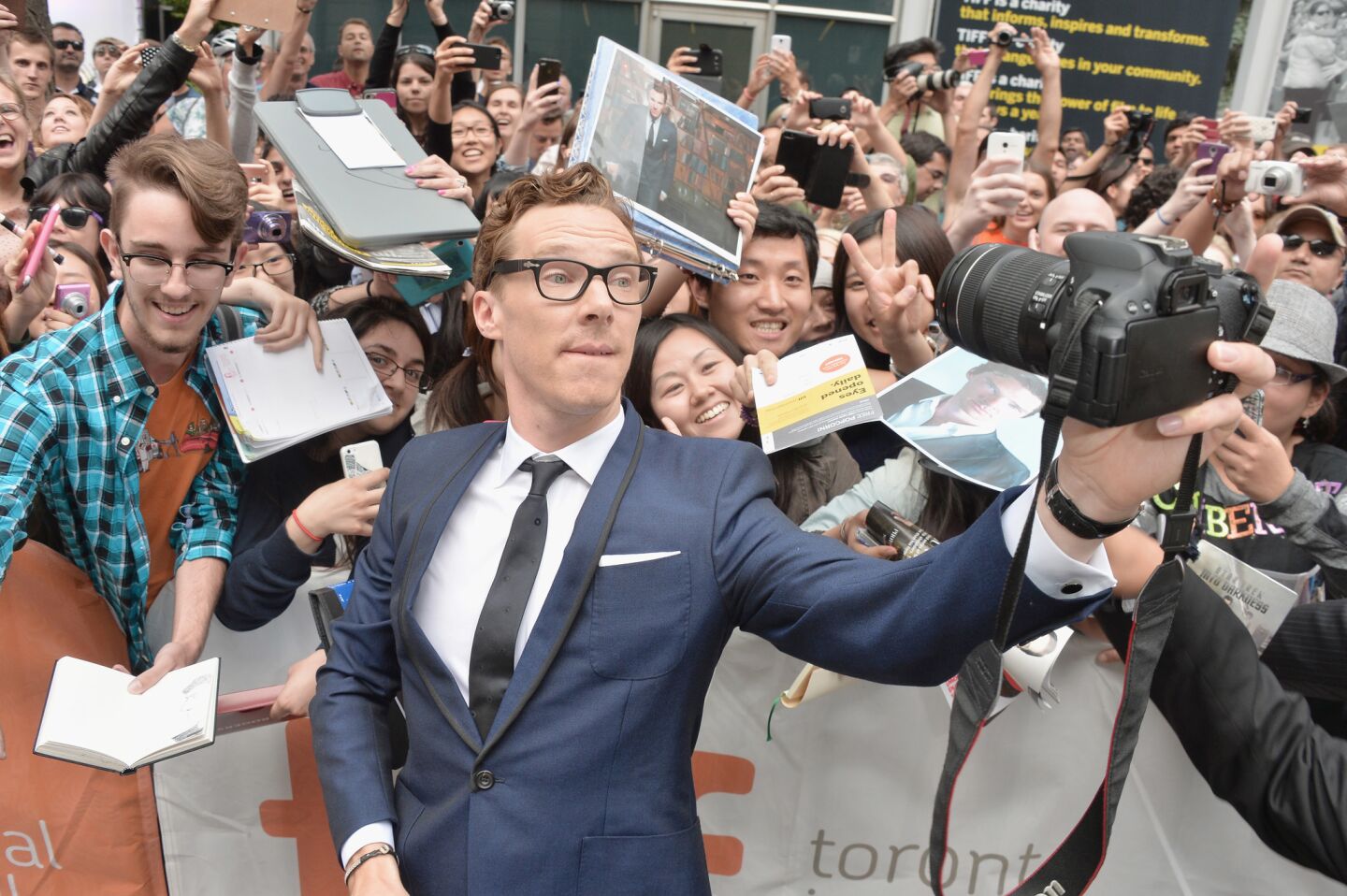 Cumberbatch, who has developed a fervent following, takes a selfie with fans at "The Imitation Game" premiere on Sept. 9, 2014.