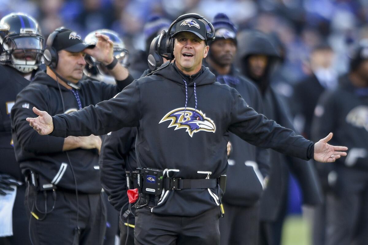 Baltimore Ravens coach John Harbaugh reacts to a call on the field during an NFL football game against the Cincinnati Bengals in Baltimore.