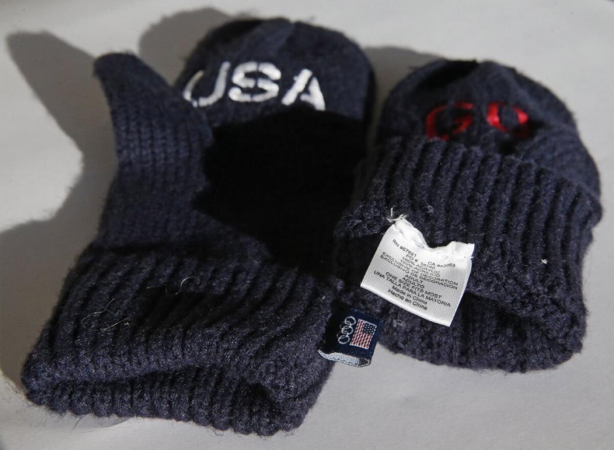 These U.S. Olympic mittens, being sold for $14, were made in China. The mittens that U.S. athletes will wear in the opening ceremony in Sochi, available for $98, are being domestically produced, a U.S. Olympic Committee spokesman said.