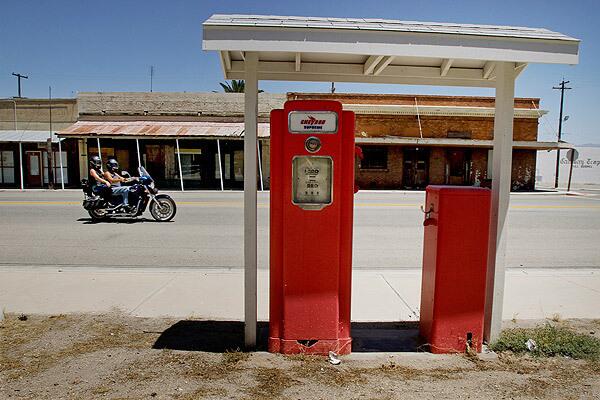 An old gasoline pump and a wooden Pacific pumping unit used during World War II sit in a park on California Street in Maricopa, a Kern County oil town in such financial straits that the county's grand jury is suggesting that it give up the cityhood it established 100 years ago this month. See full story