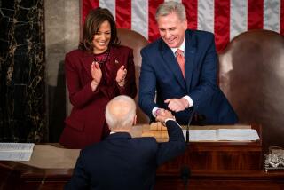 WASHINGTON, DC - FEBRUARY 07: President Joe Biden is greeted by Vice President Kamala Harris, left, and Speaker of the House Kevin McCarthy (R-CA), right, as he arrives for a State of the Union address at the U.S. Capitol on Tuesday, Feb. 7, 2023 in Washington, DC. (Kent Nishimura / Los Angeles Times)