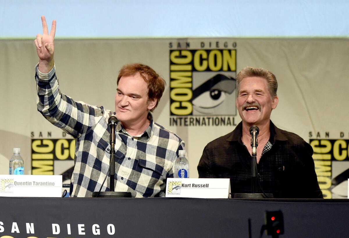 Writer/director Quentin Tarantino, left, and actor Kurt Russell speak onstage at Quentin Tarantino's "The Hateful Eight" panel during Comic-Con International 2015.