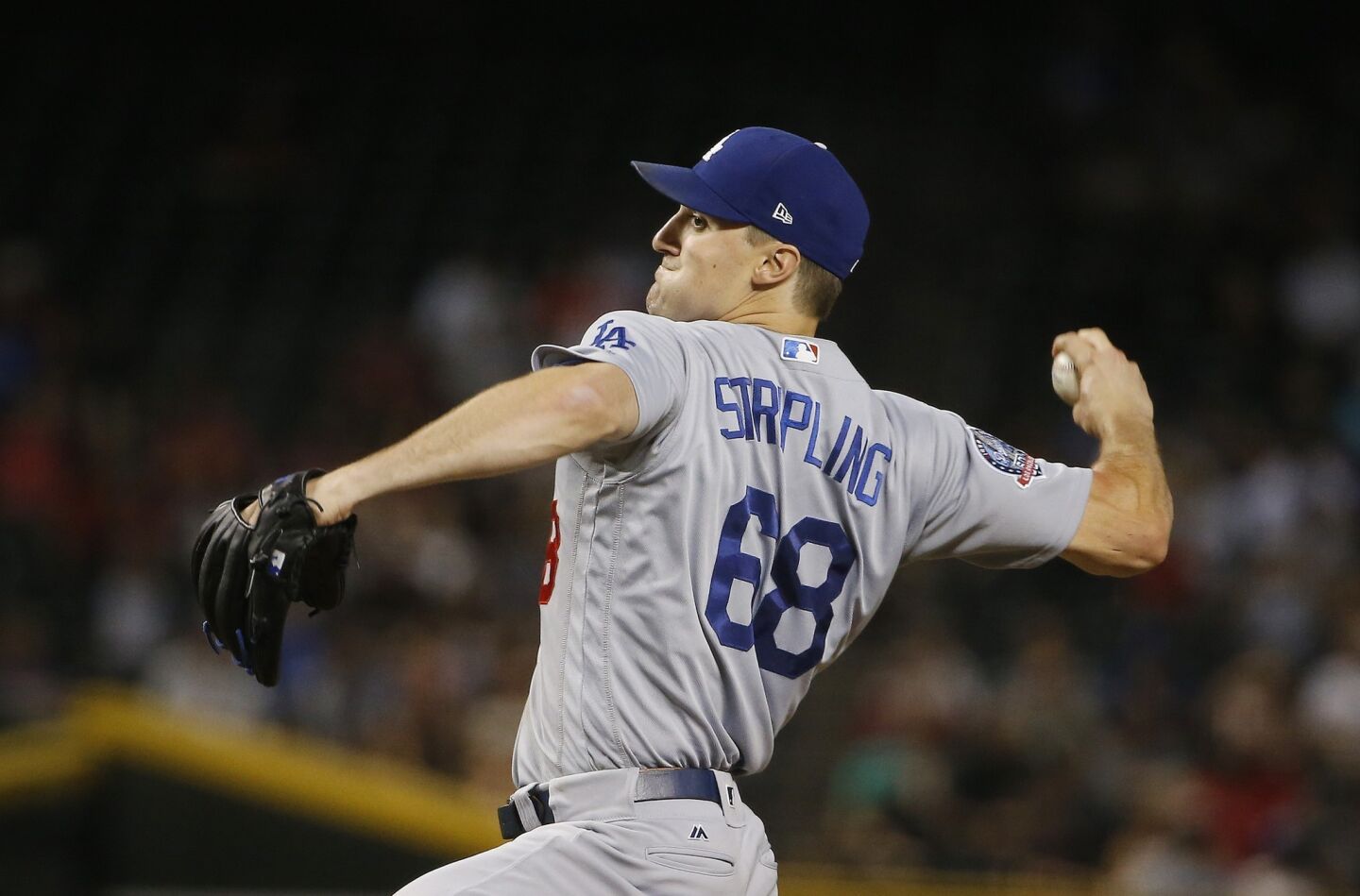 Los Angeles Dodgers starter Ross Stripling throws a pitch against the Arizona Diamondbacks during the first inning of a baseball game Wednesday, Sept. 26, 2018, in Phoenix. (AP Photo/Ross D. Franklin)