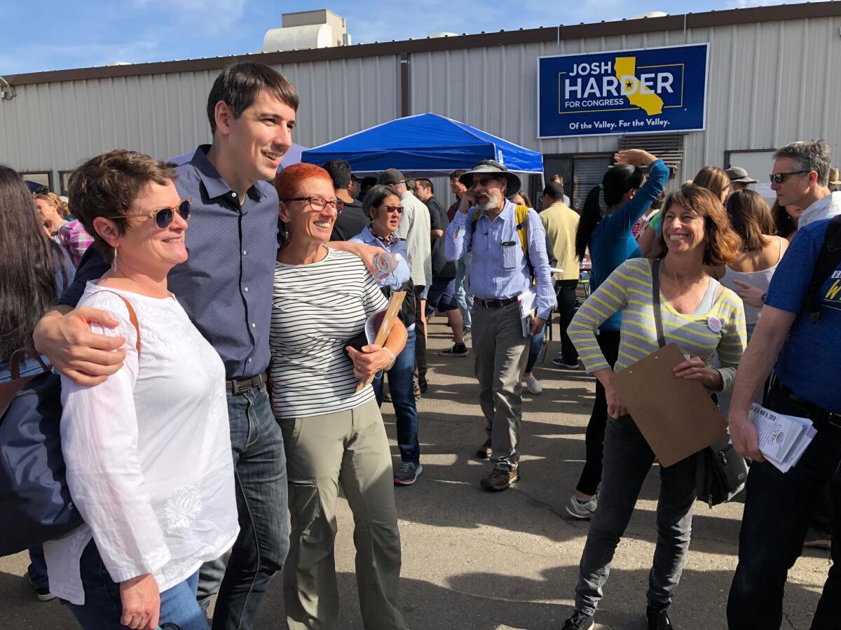 Josh Harder, 32, poses for a photo with supporters at canvass kickoff in Modesto.