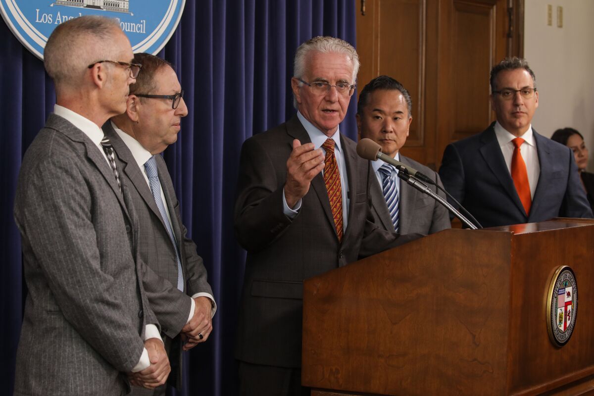 Los Angeles City council president Paul Krekorian, flanked by council members, held a press conference held at City Hall