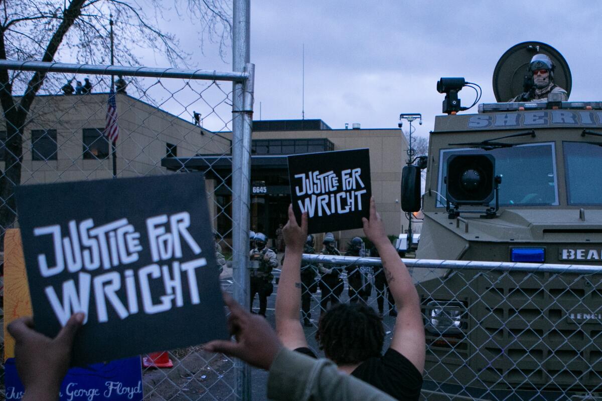 Protesters with signs that read, "Justice for Wright."