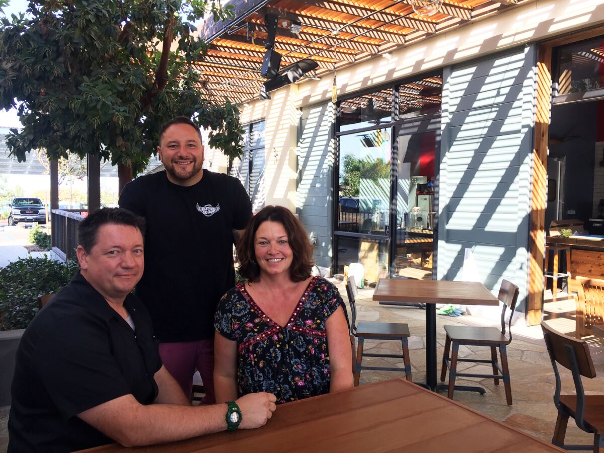 Bantam's Roost Public House business partners Roger "Roddy" Browning, left, Alex Kleinman and Aaron Browning on the new Carlsbad restaurant's covered patio.