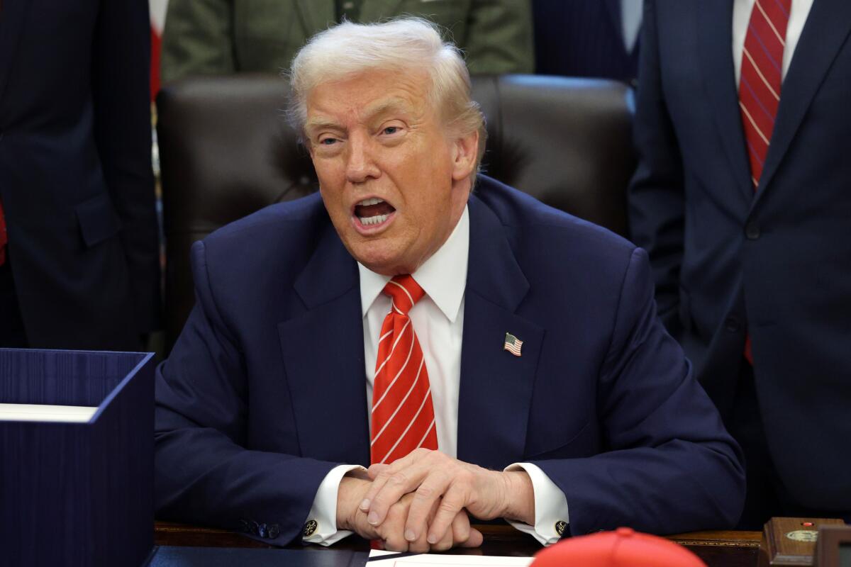 President Trump speaks during a bill signing in the Oval Office on Tuesday.