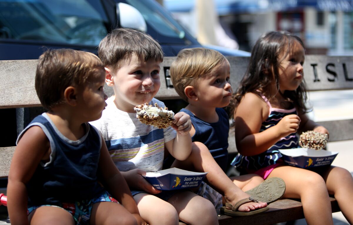 Sugar 'n Spice young customers enjoy ice cream at the Balboa Island location in Newport Beach.
