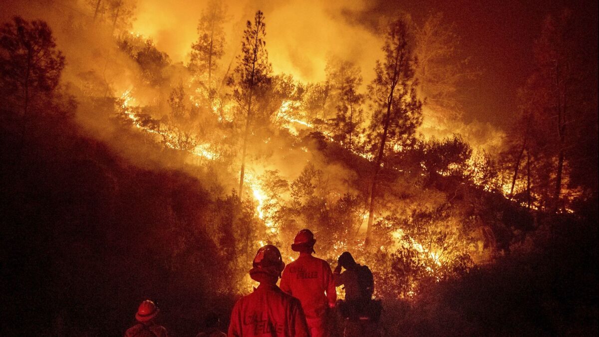 Firefighters battle the Ranch Fire near Ladoga, Calif. on August 8.