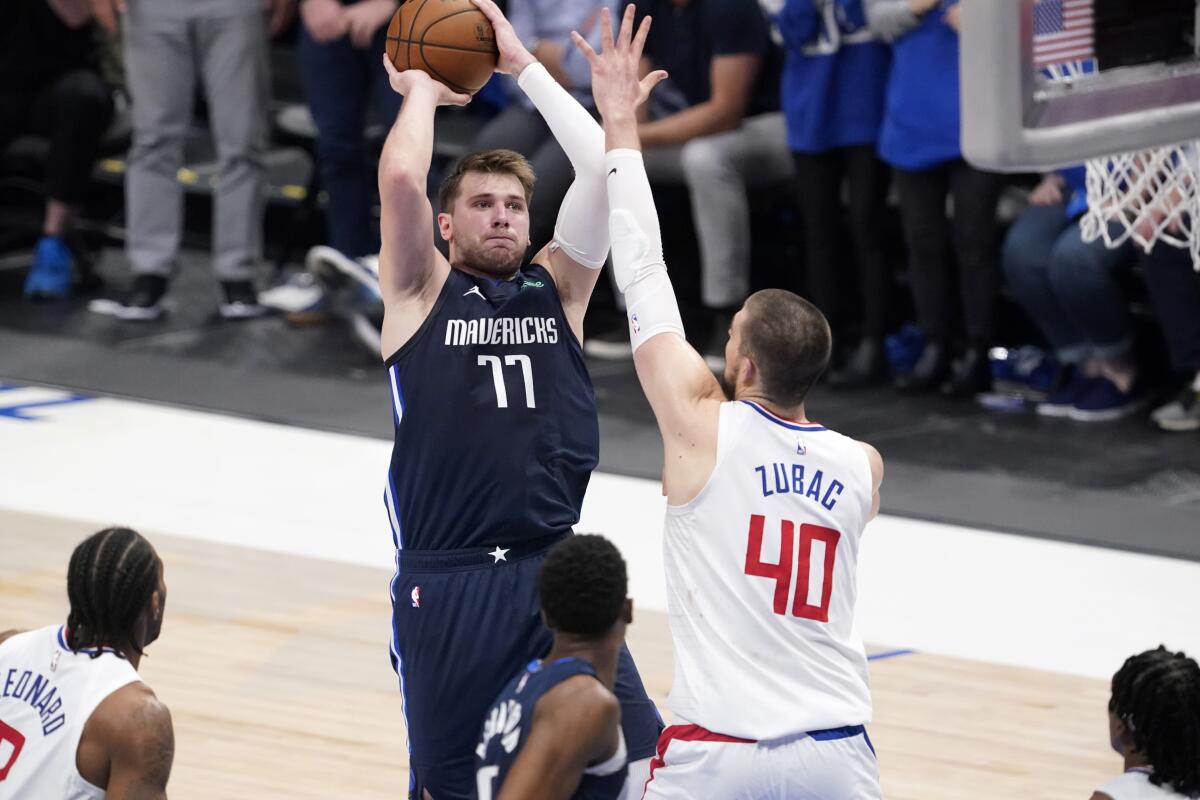 Luka Doncic shoots over the Clippers' Ivica Zubac.