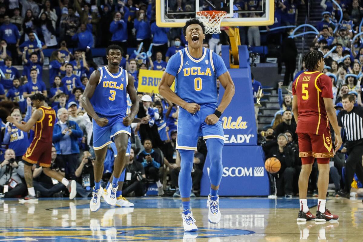 UCLA guard Jaylen Clark celebrates as the Bruins hold on to beat USC 60-58 at Pauley Pavilion.