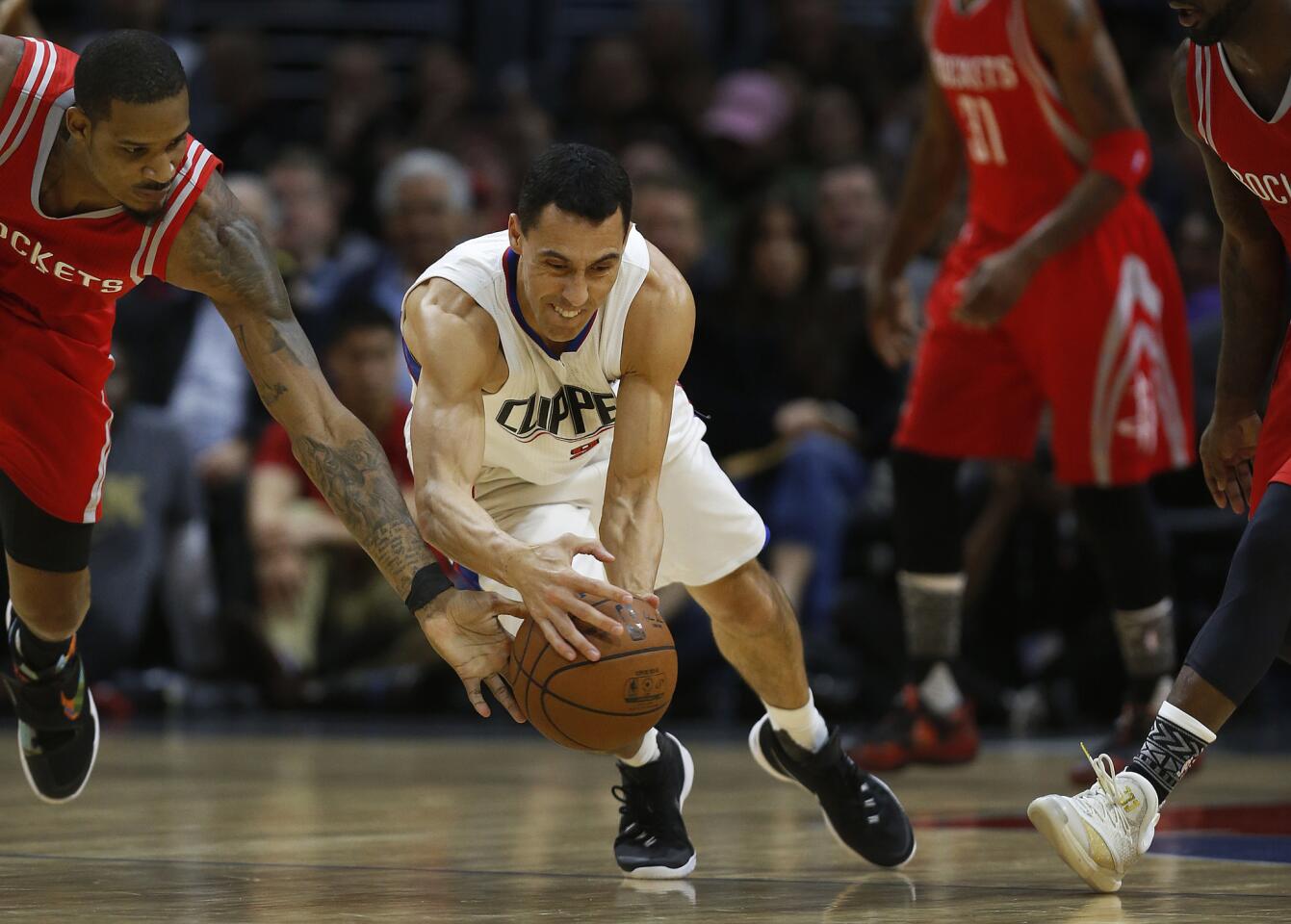 Los Angeles Clippers' Pablo Prigioni goes after a loose ball during the game against the Houston Rockets on Monday.