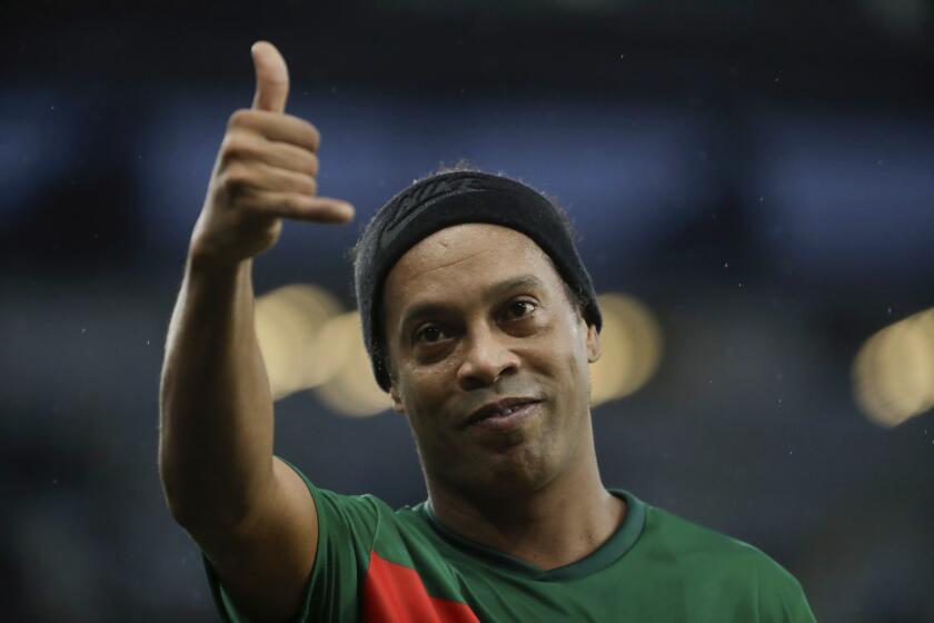Retired player Ronaldinho Gaucho gives a thumbs up during a charity soccer match to raise funds for victims of floods affecting southern Brazil, at the Maracana stadium in Rio de Janeiro, Sunday, May 26, 2024. (AP Photo/Bruna Prado)