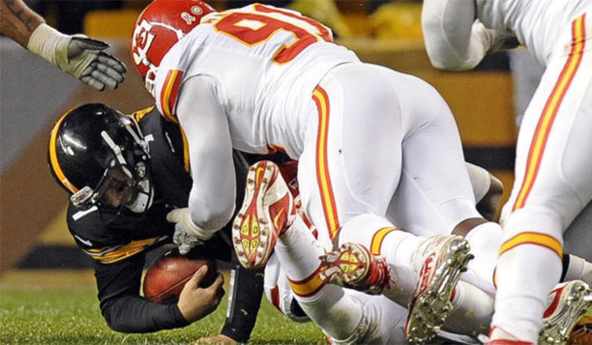 Pittsburgh quarterback Ben Roethlisberger is sacked by Kansas City linebacker Tamba Hali on Monday night. Roethlisberger left the game with a right shoulder injury.