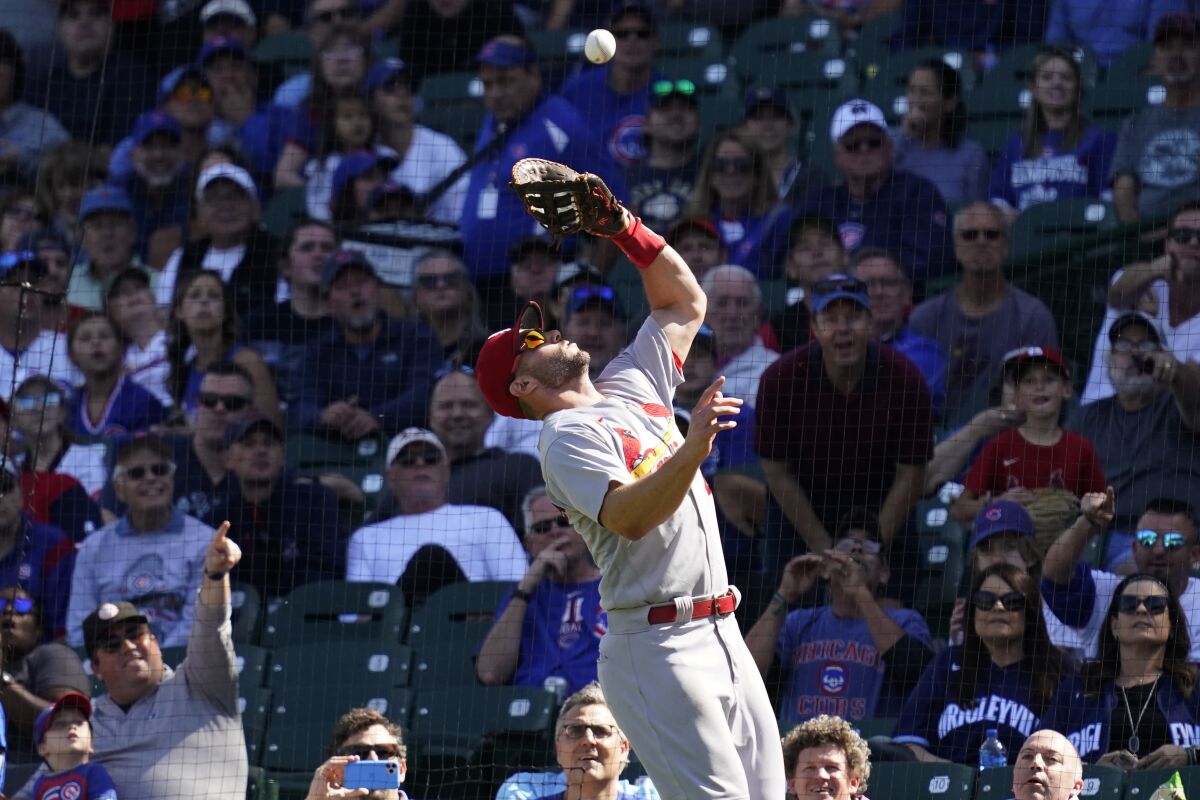 FILE - St. Louis Cardinals first baseman Paul Goldschmidt catches a fly ball hit by Chicago Cubs' Willson Contreras in foul territory during the first inning of a baseball game in Chicago, Friday, Sept. 24, 2021. A record five St. Louis players won National League Gold Gloves, with Goldschmidt, second baseman Tommy Edman, third baseman Nolan Arenado, center fielder Harrison Bader and left fielder Tyler O'Neill earning the fielding honor Sunday, Nov. 7, 2021. (AP Photo/Nam Y. Huh, File)
